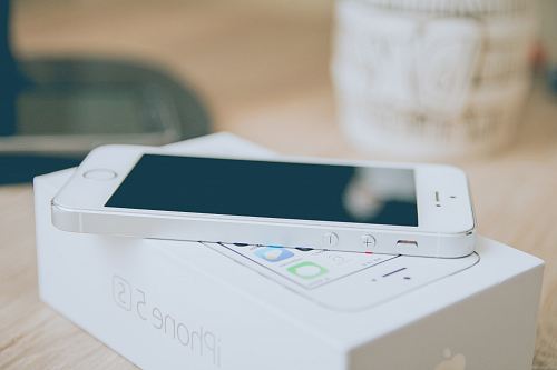 silver iPhone 5s on box